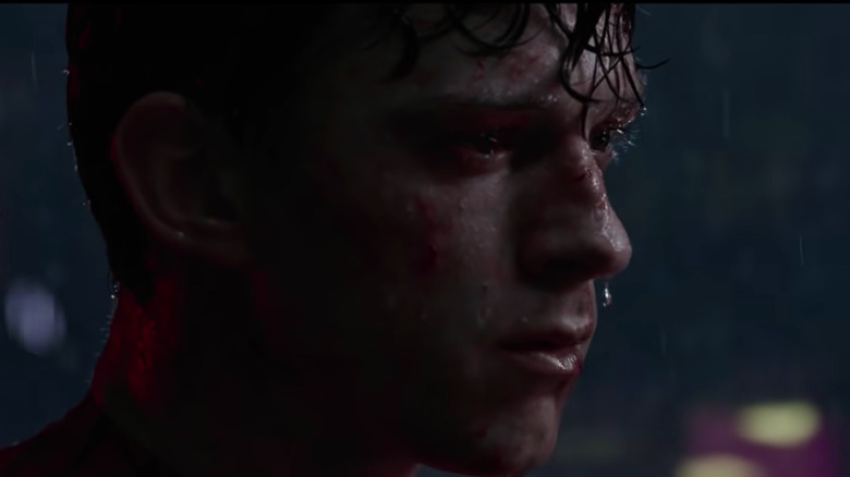 Peter Parker looking sad in the rain in Spider-Man: No Way Home