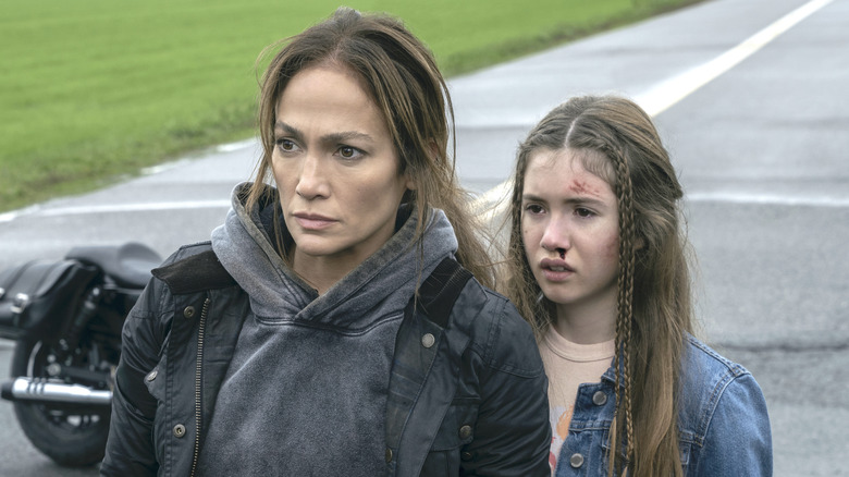 The Mother and Zoe stand in street 