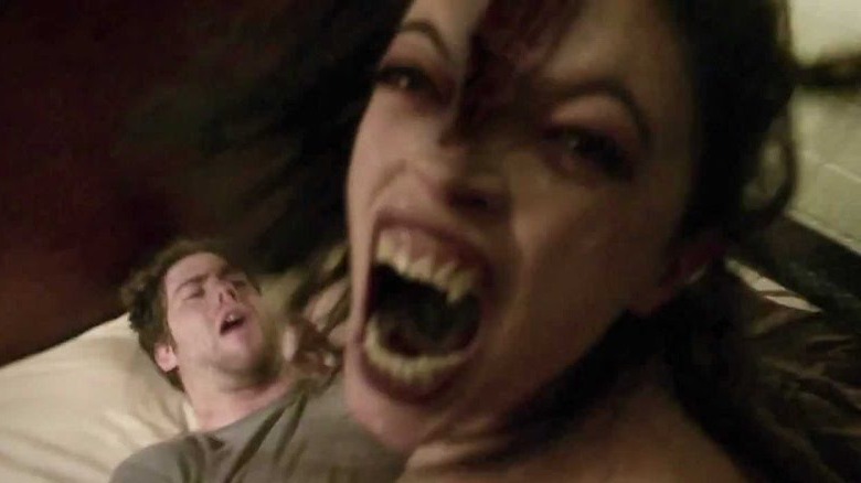 Woman growling with fangs out in V/H/S