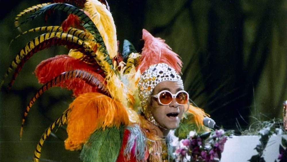 Elton John covered in feathers