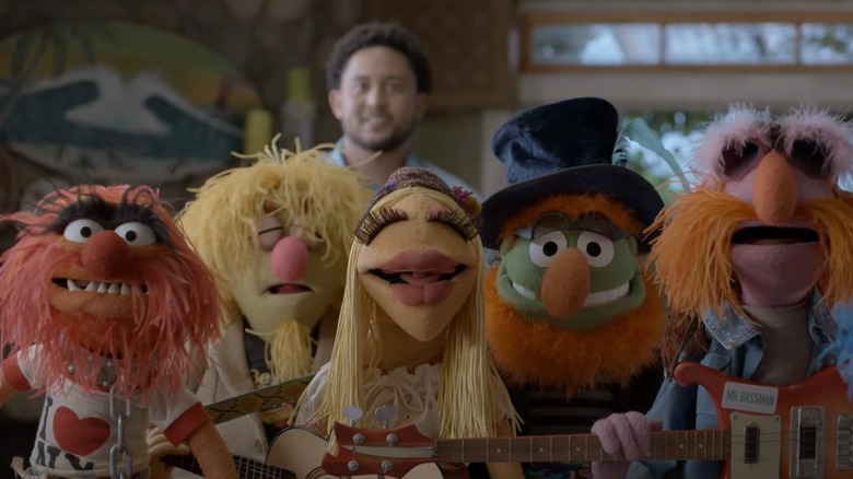 The Electric Mayhem band members smiling