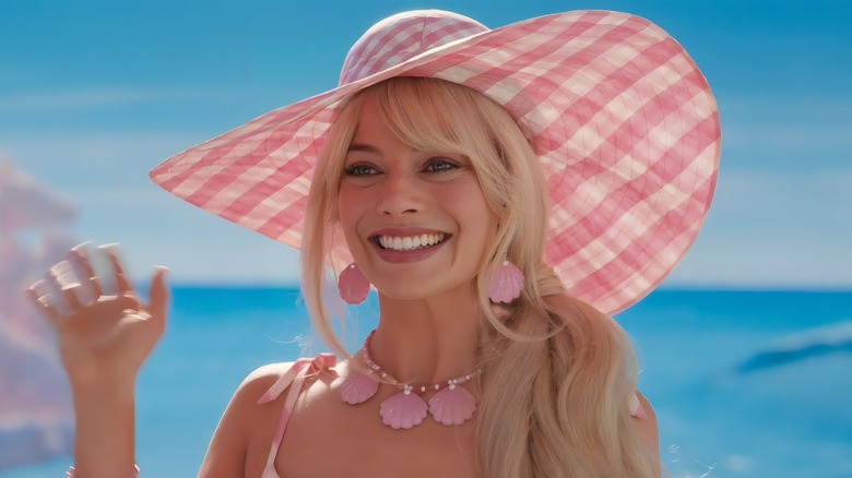 Barbie smiling wearing hat