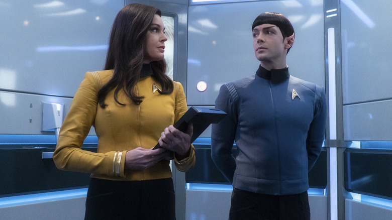 Una stands next to Spock