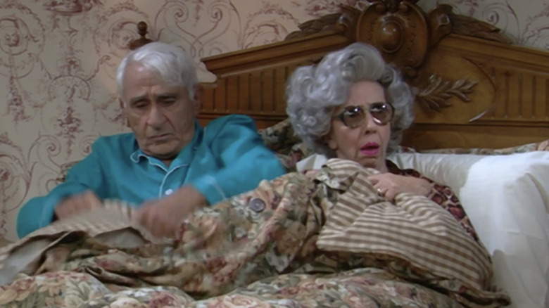 Yetta in bed with glasses