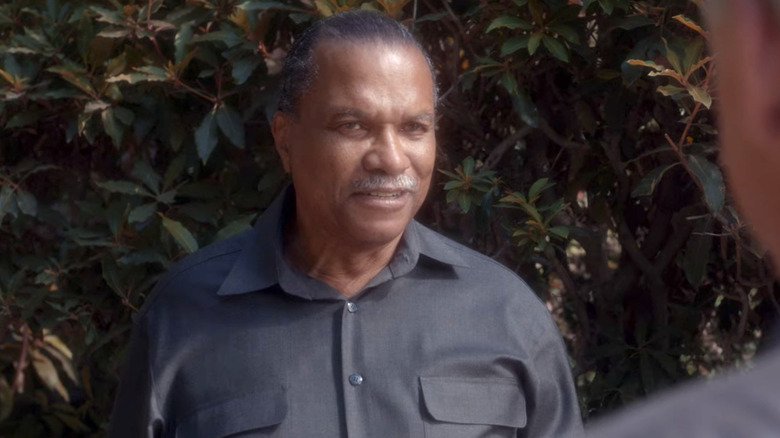 Billy Dee Williams looking at Mark Harmon