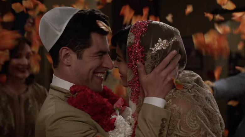 Cece and Schmidt smiling at wedding in New Girl 