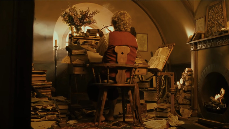 Bilbo writing in his study