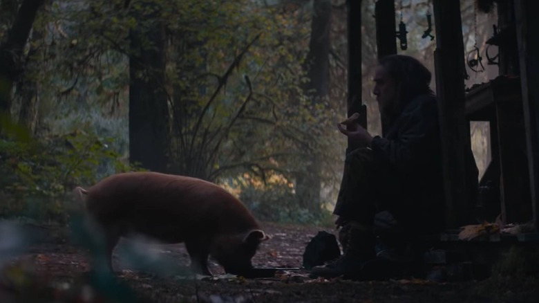 Nicolas Cage with a pig