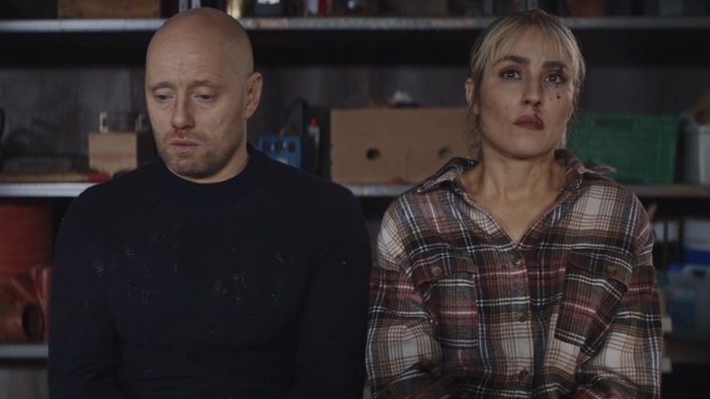 Noomi Rapace and Aksel Hennie sitting 