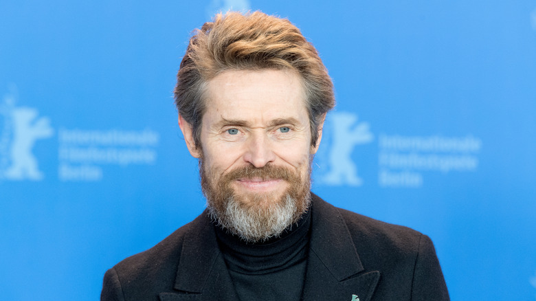 Willem Dafoe grinning