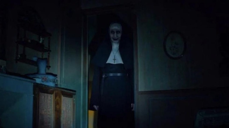 Valak being exposed by the light