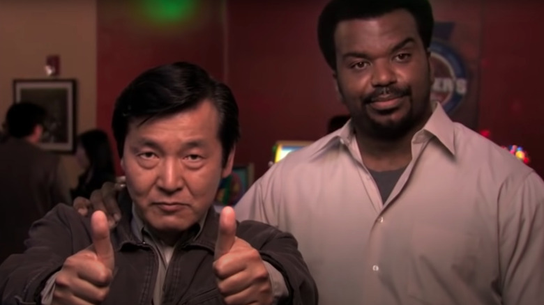 Hide giving two thumbs up next to Darryl on "The Office"