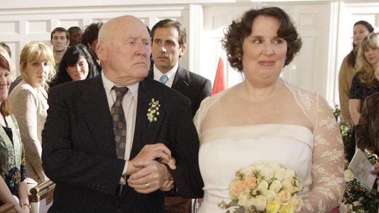 Elbert walks Phyllis down the aisle