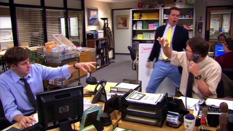 Dwight watching Andy dance