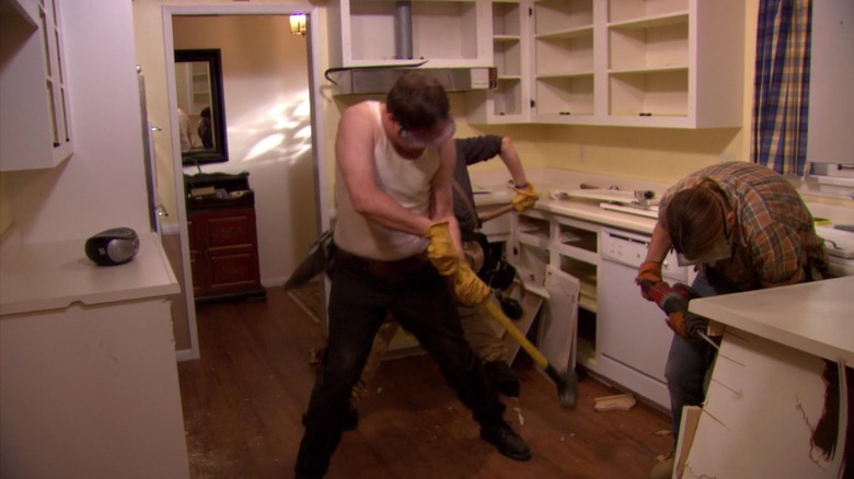 Dwight wielding a sledgehammer