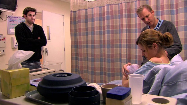 Jim looks at Pam with the lactation consultant