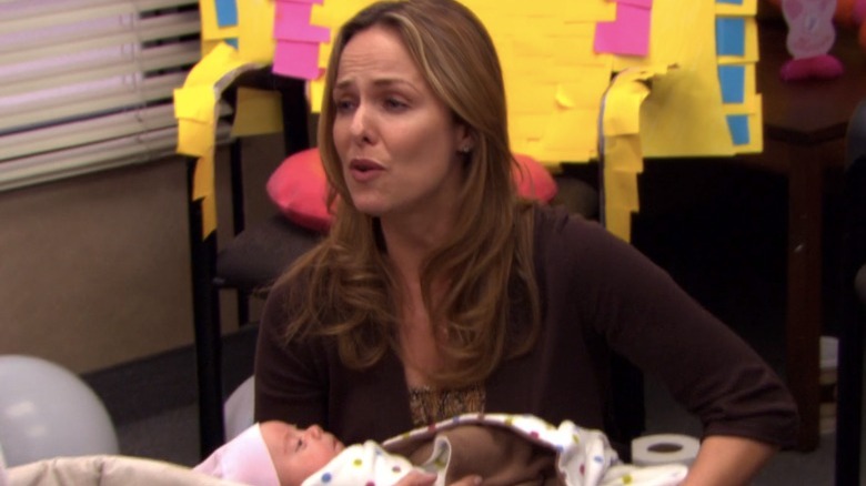 The Office's Jan cradling a baby