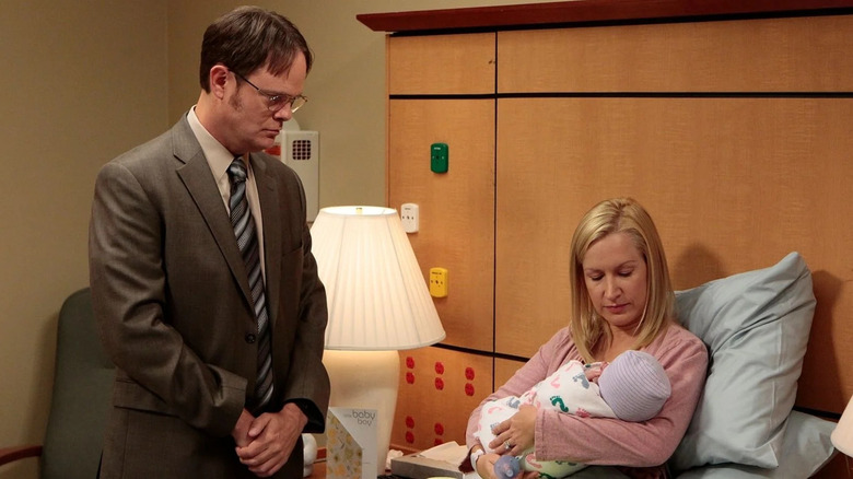 Dwight studies his son