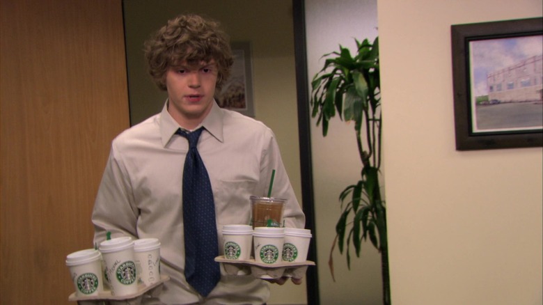 Luke Cooper holding Starbucks drinks
