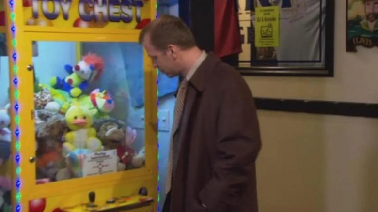 Toby playing a claw machine