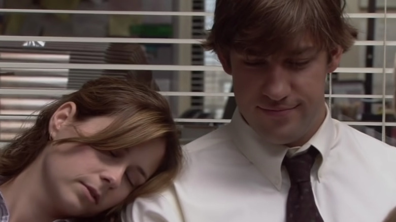 Pam sleeps on Jim's shoulder