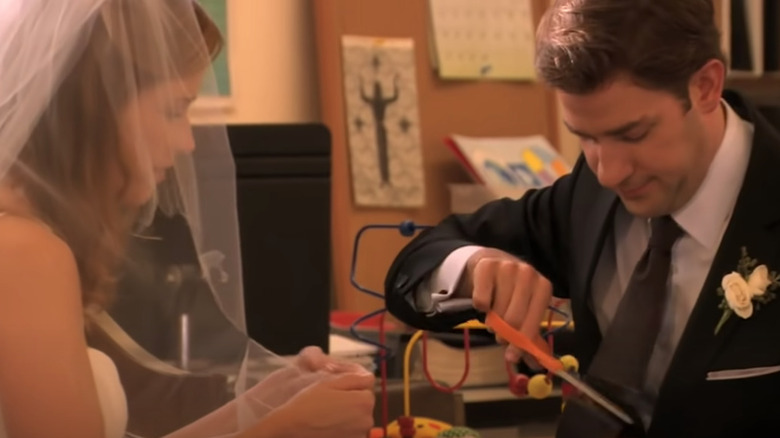 Jim cuts his wedding tie 