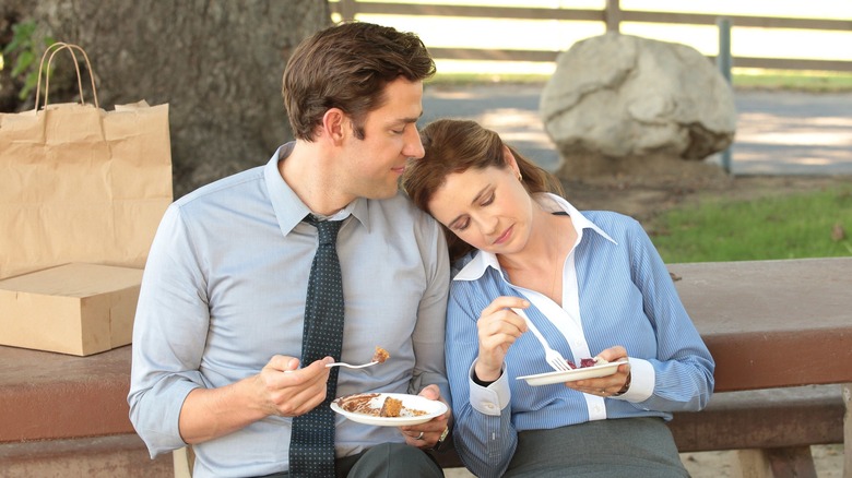 Pam leans on Jim's shoulder