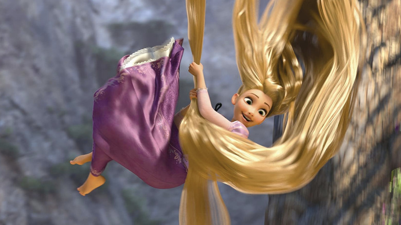 Rapunzel uses her long hair to escape her tower in Tangled (2010)