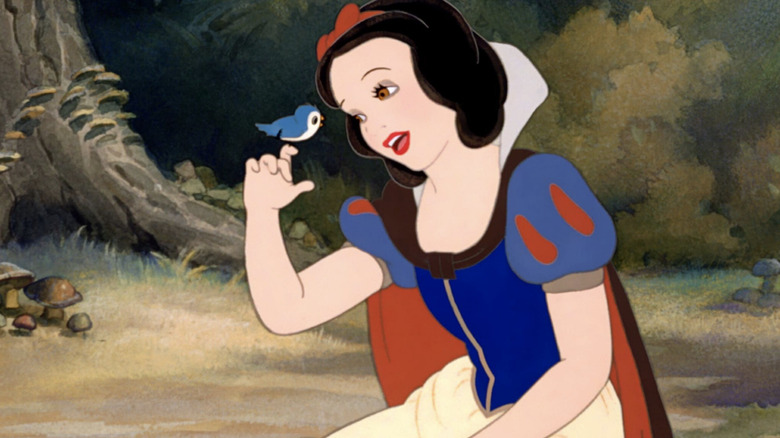 Snow White sings to a bird in Snow White and the Seven Dwarfs (1937)