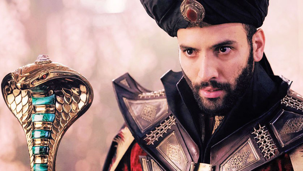 Marwan Kenzari as Jafar with cobra scepter