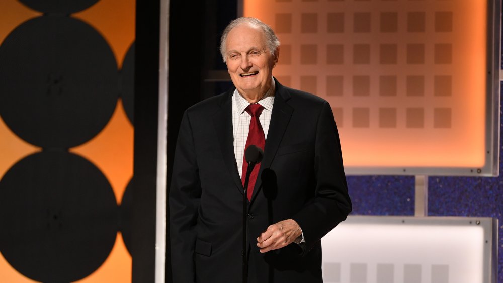 Alan Alda speaking onstage