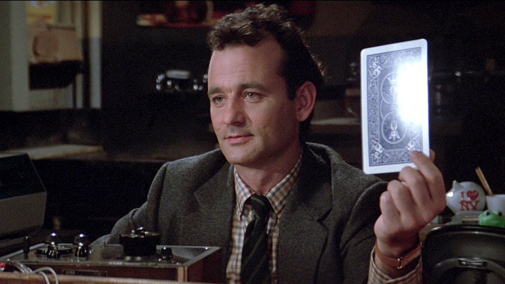 Venkman holds up card