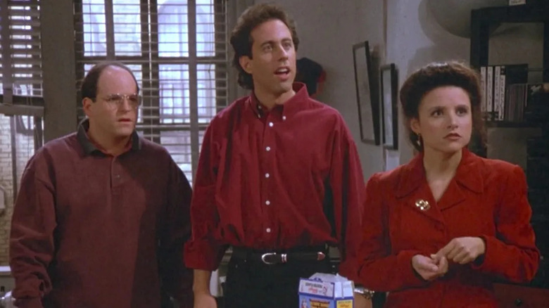 George, Jerry, and Elaine standing together