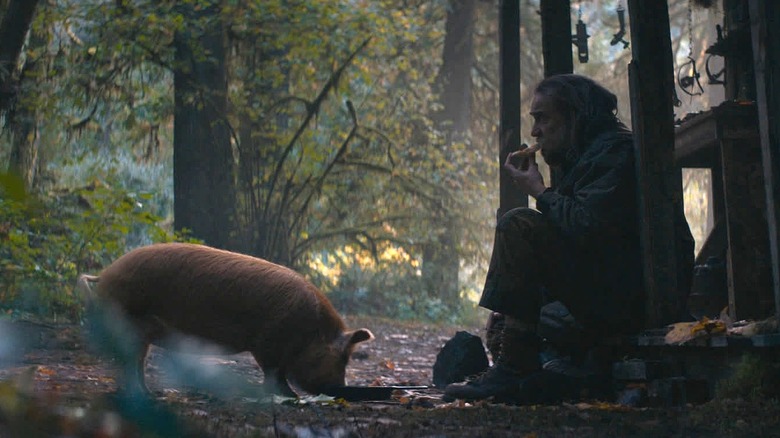 Rob in woods eating w/pig