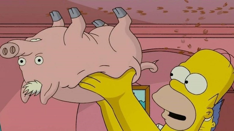 Homer lifts the pig onto the ceiling