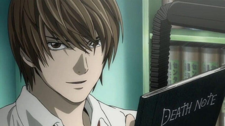 Light holding the death note