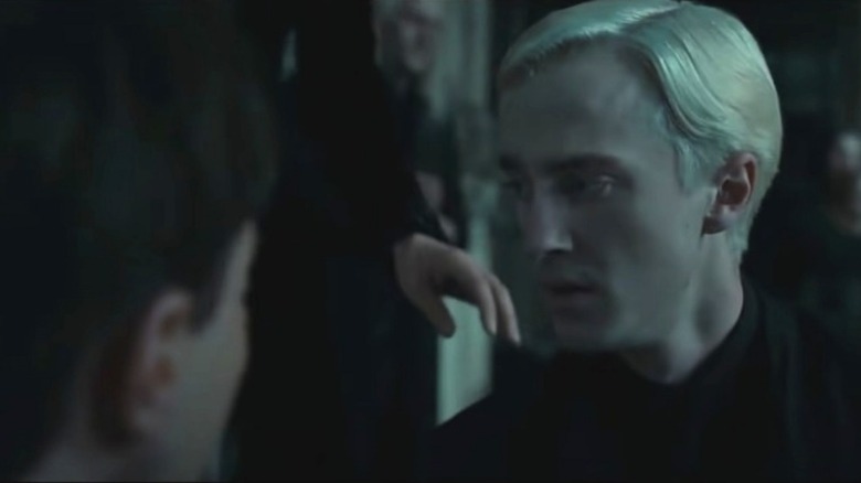 Draco Malfoy looking at Harry Potter