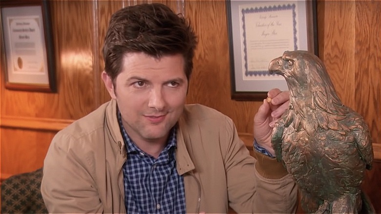 Ben feeding an eagle statue