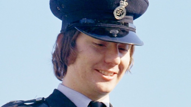 Georgie as police officer