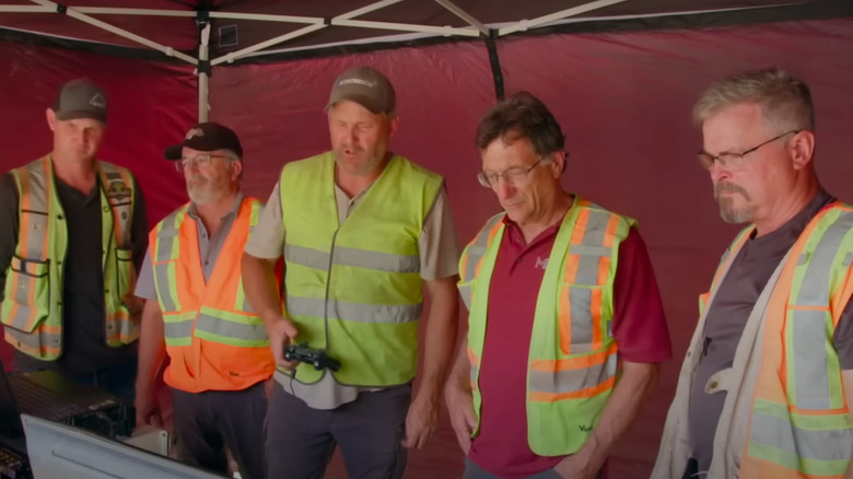 Oak Island team in a red tent. 