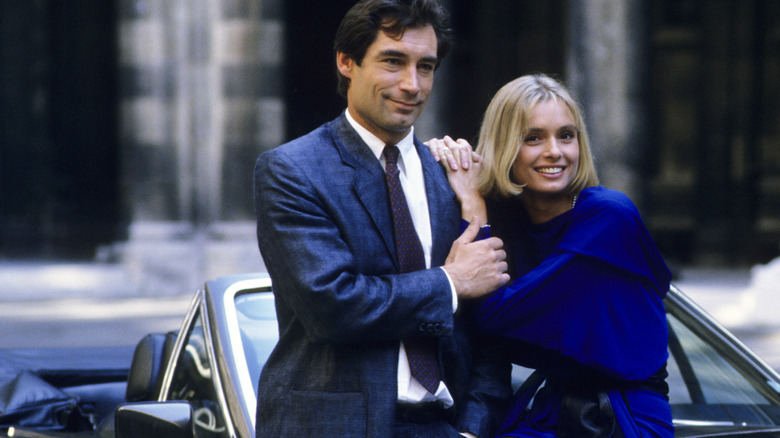 Timothy Dalton and Maryam D'Abo posing