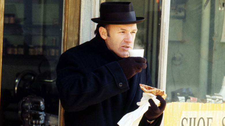 Popeye Doyle drinks coffee