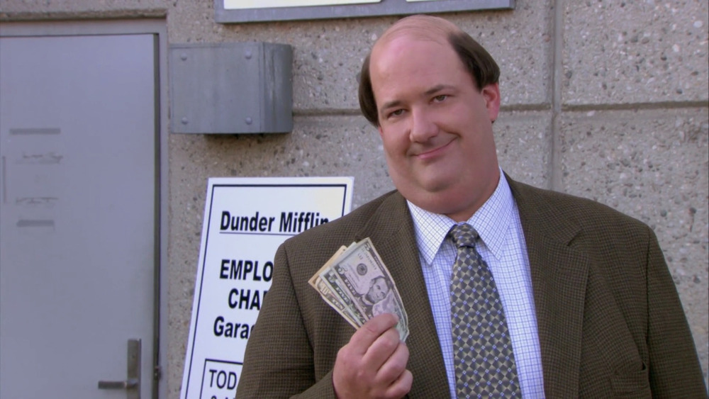 Kevin Malone holding money