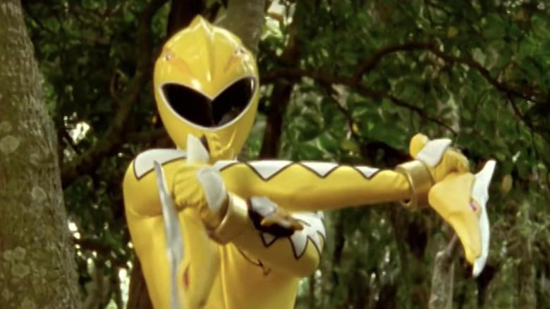 Yellow Ranger holds yellow knives