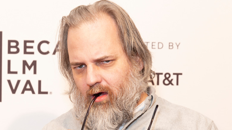 Dan Harmon chewing on glasses