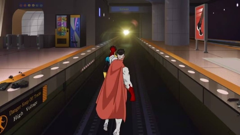 Omni-Man holds Mark in front of a train during the "Invincible" Season 1 finale (2021)