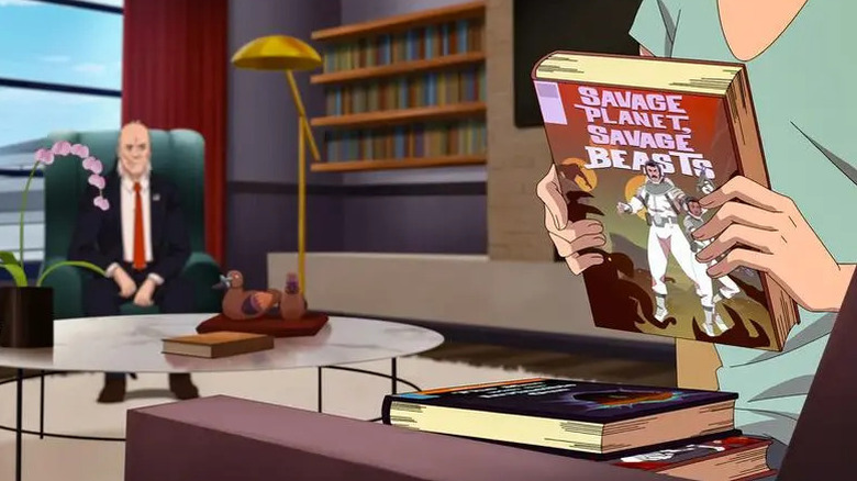 Debbie holds Nolan's books on "Invincible" (2023)