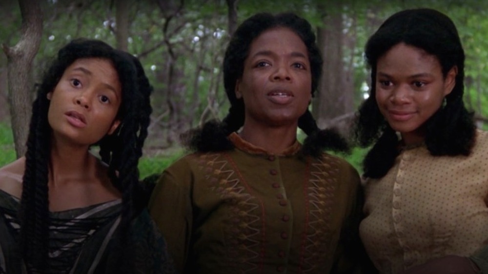 Thandie Newton, Oprah Winfrey, and Kimberly Elise in a scene from Beloved 