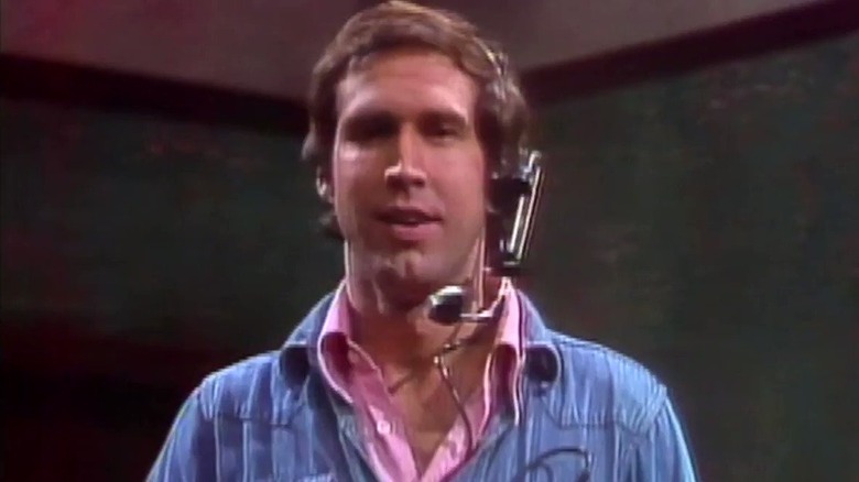 SNL's Chevy Chase wearing headset