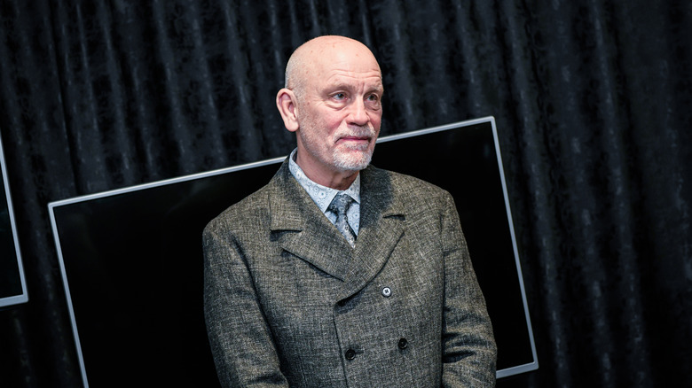 John Malkovich posing at a film festival